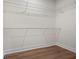 Spacious walk-in closet featuring vinyl floors and wire shelving at 1687 Harmony Rd, Temple, GA 30179