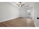 Spacious main bedroom boasts a ceiling fan and a bright window at 1687 Harmony Rd, Temple, GA 30179