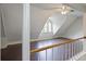 Attic space with carpet and a ceiling fan at 172 Forest Nw Ln, Marietta, GA 30064
