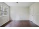 Bright bedroom features hard wood floors, a window, and neutral colored walls at 172 Forest Nw Ln, Marietta, GA 30064