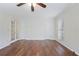 Bedroom featuring laminate flooring, a ceiling fan, and good closet space at 172 Forest Nw Ln, Marietta, GA 30064