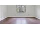 Bedroom boasts hardwood floors and a window overlooking lush greenery at 172 Forest Nw Ln, Marietta, GA 30064