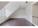 Attic bedroom featuring dark wood floors, a window, and angled ceilings at 172 Forest Nw Ln, Marietta, GA 30064