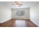 Cozy bedroom featuring wood floors, a ceiling fan, and large bay window that provides an abundance of natural light at 172 Forest Nw Ln, Marietta, GA 30064