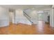 View of a staircase and living room with wood floors, and lots of natural light at 172 Forest Nw Ln, Marietta, GA 30064