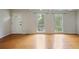 Bright living room with hardwood floors, white trim, and plenty of natural light from the two large windows at 172 Forest Nw Ln, Marietta, GA 30064