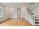 Spacious living room with hardwood floors and a staircase leading to the second floor at 172 Forest Nw Ln, Marietta, GA 30064