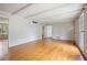 Open-concept living room with hardwood floors, large windows and ample space for entertaining at 172 Forest Nw Ln, Marietta, GA 30064