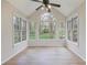Sunroom featuring multiple windows and a ceiling fan at 172 Forest Nw Ln, Marietta, GA 30064