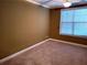 Bedroom featuring carpeted floors, a ceiling fan, and a large window with natural light at 1910 Cedar Glenn Way # 4104, Atlanta, GA 30339