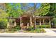 Community clubhouse showcasing the building's facade, landscaping, and manicured lawn at 1910 Cedar Glenn Way # 4104, Atlanta, GA 30339