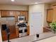 Well-equipped kitchen features stainless steel appliances and wood cabinetry at 1910 Cedar Glenn Way # 4104, Atlanta, GA 30339