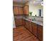Spacious kitchen featuring wood cabinetry, stainless steel appliances, and an eat-in bar at 1910 Cedar Glenn Way # 4104, Atlanta, GA 30339