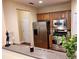 Modern kitchen featuring stainless steel appliances, wood cabinets, and a breakfast bar with natural light at 1910 Cedar Glenn Way # 4104, Atlanta, GA 30339