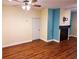 Comfortable living room with wood floors, a ceiling fan, a fireplace, and neutral walls at 1910 Cedar Glenn Way # 4104, Atlanta, GA 30339