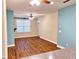 Open-concept living room with wood floors, a ceiling fan, and neutral walls at 1910 Cedar Glenn Way # 4104, Atlanta, GA 30339