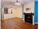Spacious living room offering wood floors, a fireplace, and an open layout to the kitchen at 1910 Cedar Glenn Way # 4104, Atlanta, GA 30339
