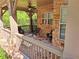 Stone-accented porch area featuring tile flooring, a ceiling fan, and outdoor seating at 1910 Cedar Glenn Way # 4104, Atlanta, GA 30339