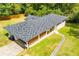 Aerial view showcasing the new roof and the well-manicured lawn of this charming single-story home at 5950 Central Church Rd, Douglasville, GA 30135