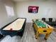 Basement recreation area featuring air hockey and foosball tables at 5950 Central Church Rd, Douglasville, GA 30135