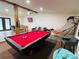Basement featuring a pool table, foosball table, and seating area for leisure at 5950 Central Church Rd, Douglasville, GA 30135
