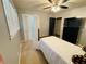 The bedroom features carpet flooring, a ceiling fan, and bright natural light at 5950 Central Church Rd, Douglasville, GA 30135
