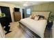 Bedroom with a TV and dresser, a ceiling fan, wainscotting, carpet, and a king bed at 5950 Central Church Rd, Douglasville, GA 30135