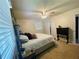 Bedroom featuring a ceiling fan, carpet, a king bed, and neutral walls at 5950 Central Church Rd, Douglasville, GA 30135