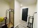 Well-lit entryway with luxury vinyl plank flooring and plenty of room for organization at 5950 Central Church Rd, Douglasville, GA 30135