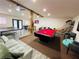 Open game room boasts a pool table, ping pong, foosball, TV, and comfortable seating for relaxation and entertainment at 5950 Central Church Rd, Douglasville, GA 30135