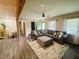 Bright living room boasts stylish decor, wood floors, and a comfortable seating area at 5950 Central Church Rd, Douglasville, GA 30135