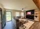 Comfortable living room features a fireplace, ceiling fan, stylish decor, and luxury vinyl flooring at 5950 Central Church Rd, Douglasville, GA 30135