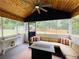 Relaxing screened-in sunroom featuring a ceiling fan and an outdoor view at 5950 Central Church Rd, Douglasville, GA 30135