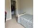 Bedroom featuring a twin bed and closet, offering comfortable living space at 10825 Pinewalk Forest Cir, Alpharetta, GA 30022