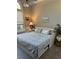 Bedroom with a bed that has built-in drawers for extra storage and a large window for natural light at 10825 Pinewalk Forest Cir, Alpharetta, GA 30022