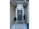 Welcoming front entryway with decorative door and charming potted plants at 10825 Pinewalk Forest Cir, Alpharetta, GA 30022