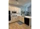 Bright kitchen featuring white cabinetry, modern appliances, and tile floors at 10825 Pinewalk Forest Cir, Alpharetta, GA 30022