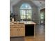 Kitchen with stainless steel appliances, white cabinets, a center island, and a view of the backyard at 10825 Pinewalk Forest Cir, Alpharetta, GA 30022