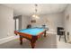 Finished basement featuring a pool table and a bar area with lighting at 2012 Golfers Way, Villa Rica, GA 30180