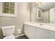Bathroom features a single sink vanity with a large mirror and window at 2012 Golfers Way, Villa Rica, GA 30180
