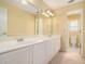 Bathroom featuring a double vanity, neutral walls and floors, with a toilet in the water closet at 2012 Golfers Way, Villa Rica, GA 30180