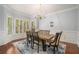 Elegant dining room with hardwood floors, chandelier and natural light at 2012 Golfers Way, Villa Rica, GA 30180