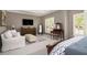 Spacious main bedroom suite offers lots of natural light, seating area, and an ensuite bath at 2012 Golfers Way, Villa Rica, GA 30180