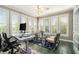 Bright office room with tiled floors features lots of windows, desk and office equipment at 2012 Golfers Way, Villa Rica, GA 30180