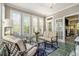 Bright sun room with tiled floors features lots of windows and a view to the outdoors at 2012 Golfers Way, Villa Rica, GA 30180
