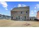 Wide open backyard with a newly constructed brick home at 612 Leafy Branch Way, Mcdonough, GA 30253