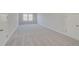 Large bonus room with neutral carpeting and doors leading to other rooms at 612 Leafy Branch Way, Mcdonough, GA 30253