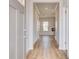 Inviting foyer with wood-look flooring, neutral walls, and access to multiple rooms at 612 Leafy Branch Way, Mcdonough, GA 30253