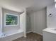 Bathroom with a soaking tub, a glass shower and a single sink vanity at 956 Buckhorn Bnd, Locust Grove, GA 30248