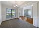 Bright dining room with large windows and elegant trim at 956 Buckhorn Bnd, Locust Grove, GA 30248